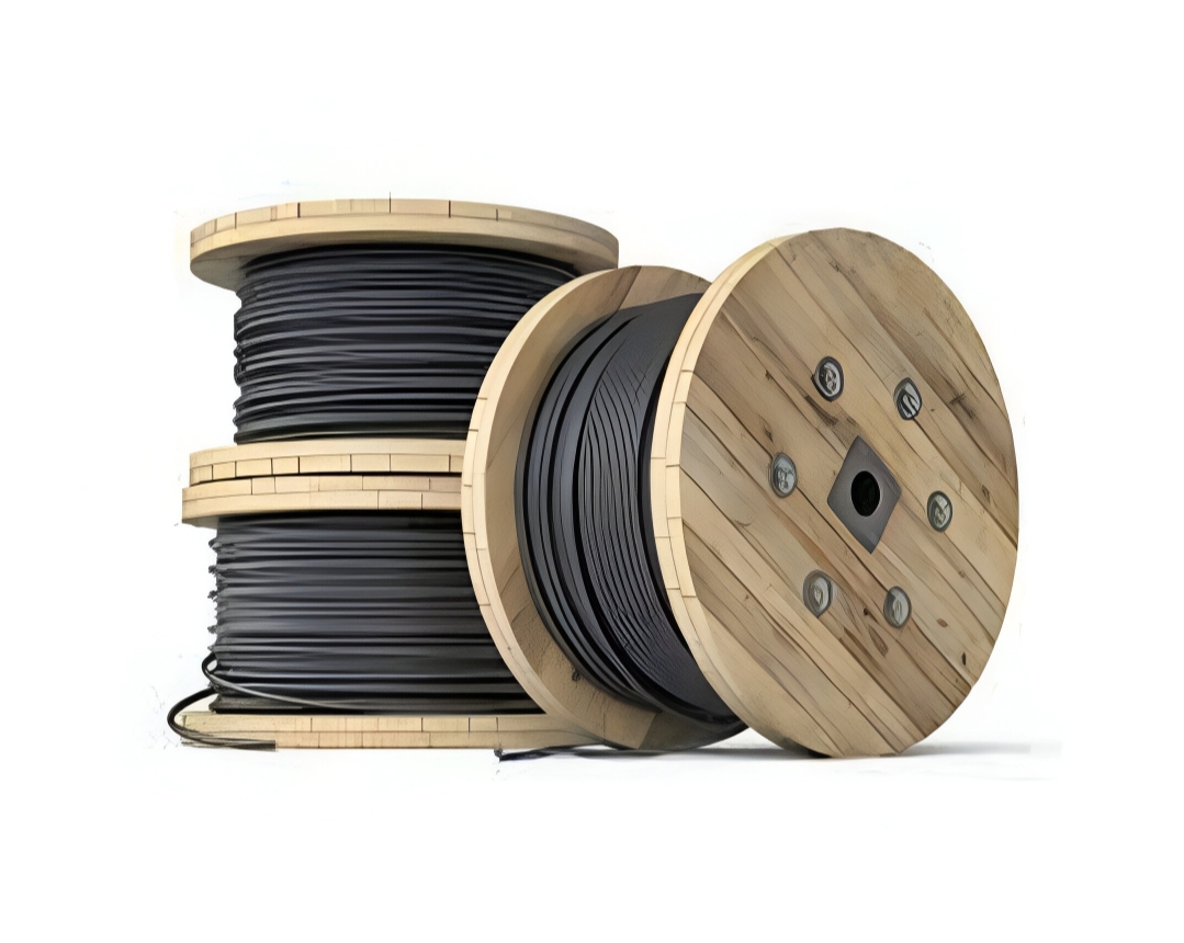 A sturdy wooden cable drum on its side, showing the flanges and central barrel